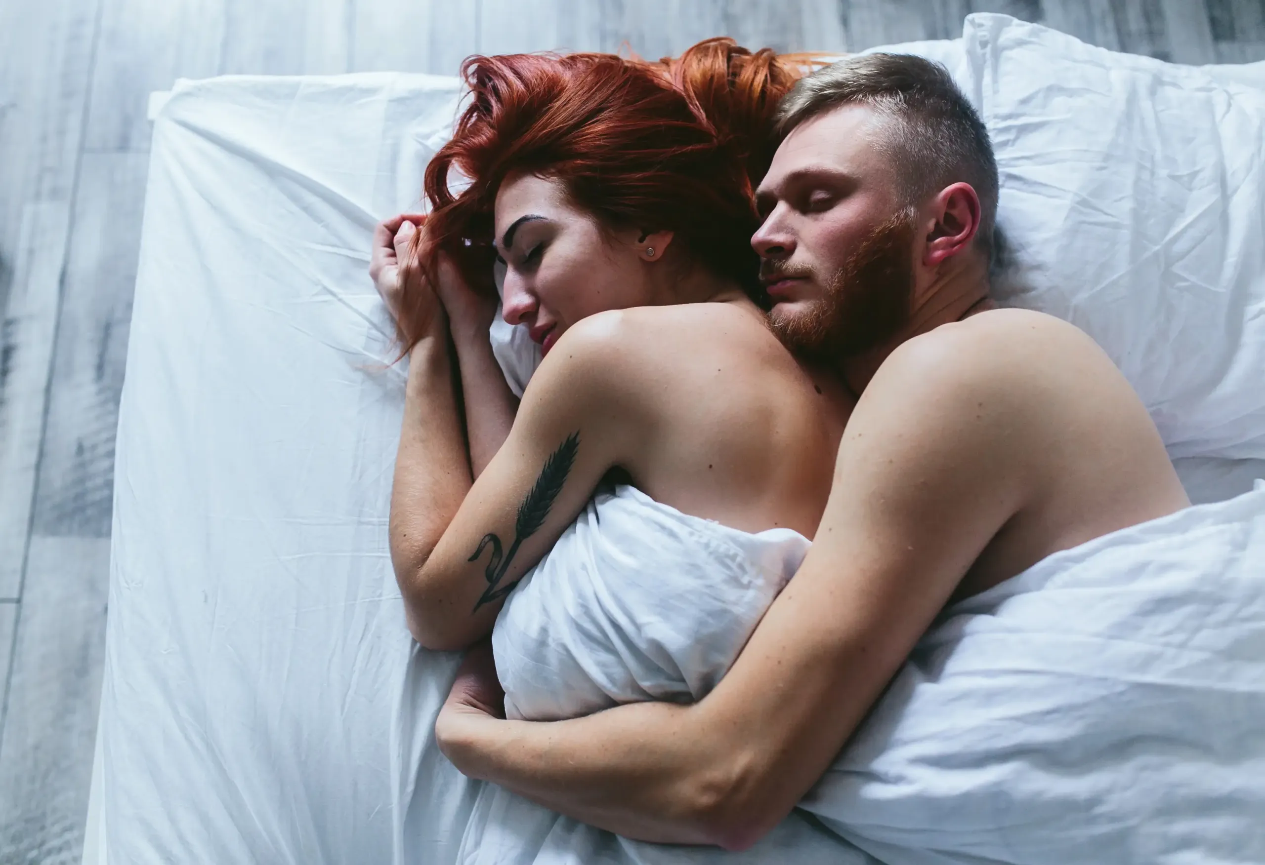 couple exploring intimacy and comfort in the bedroom