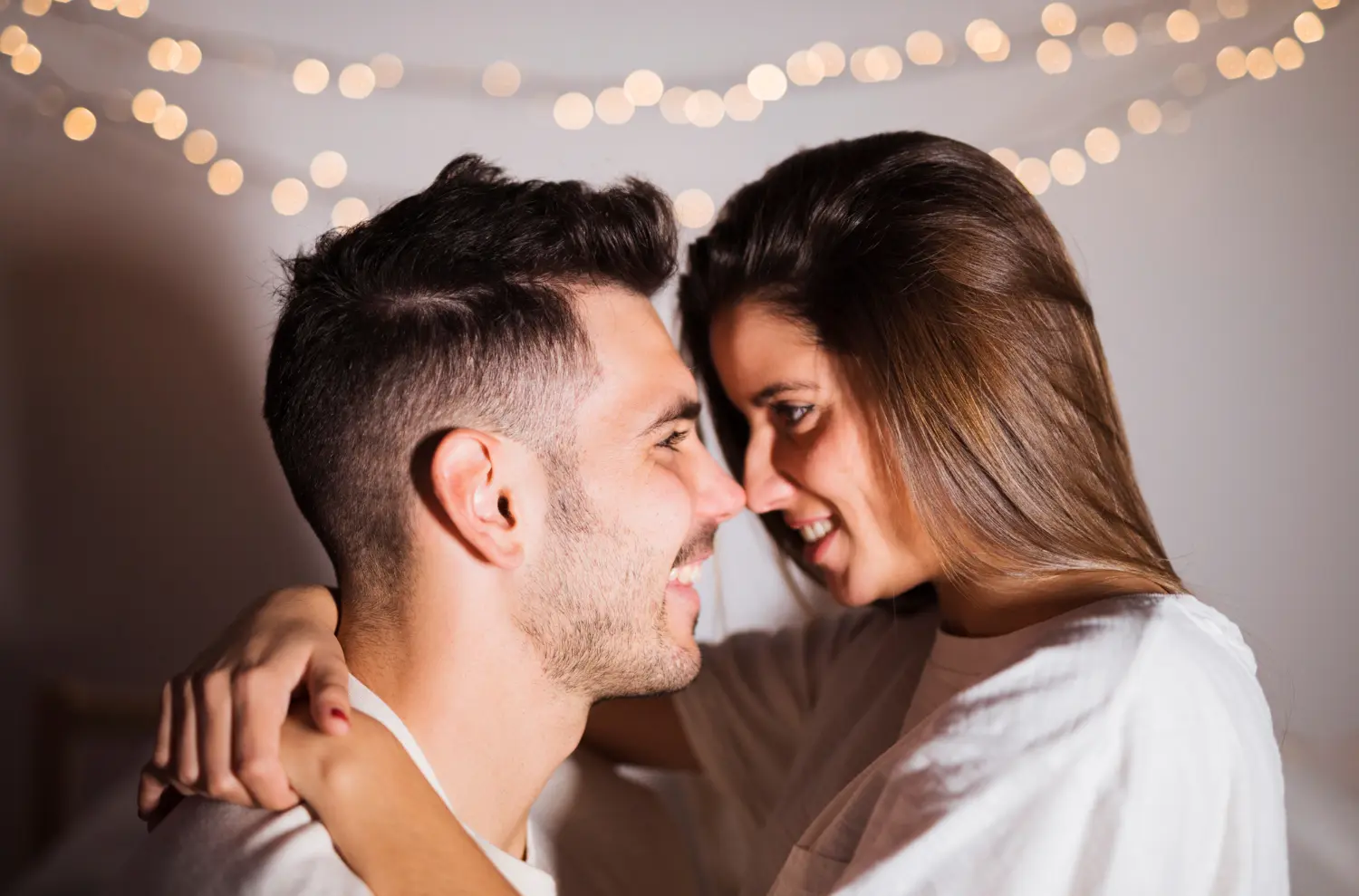 Adult couple smiling close together, representing daddy kink, emotional safety, trust, and consensual intimacy